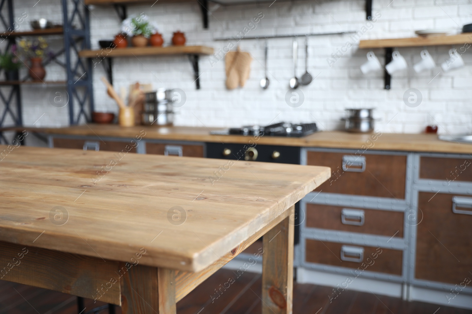 Photo of Empty wooden table in beautiful kitchen. Interior design