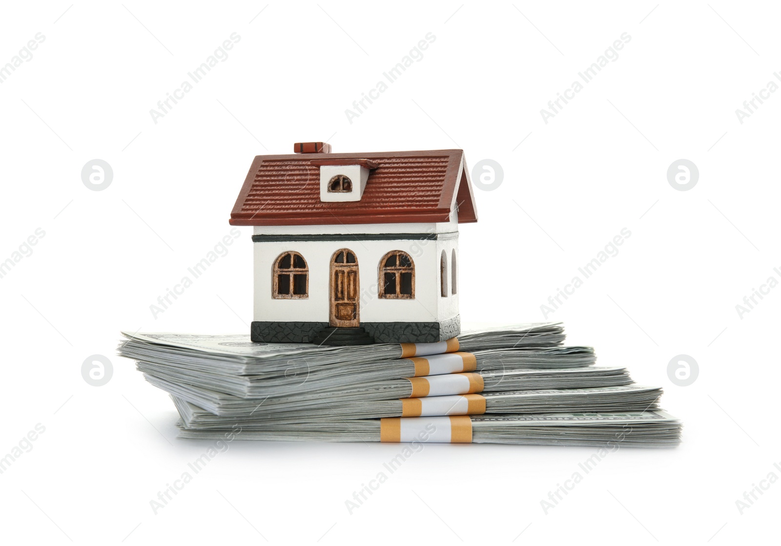 Photo of House model with money on white background