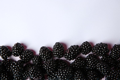 Photo of Composition with ripe blackberries on white background, top view