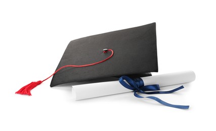 Photo of Graduation hat and diploma on white background