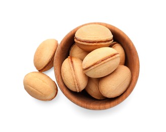 Photo of Delicious nut shaped cookies with boiled condensed milk in wooden bowl on white background, top view