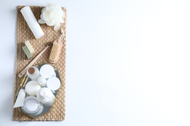 Bath accessories. Flat lay composition with personal care products on white background, space for text