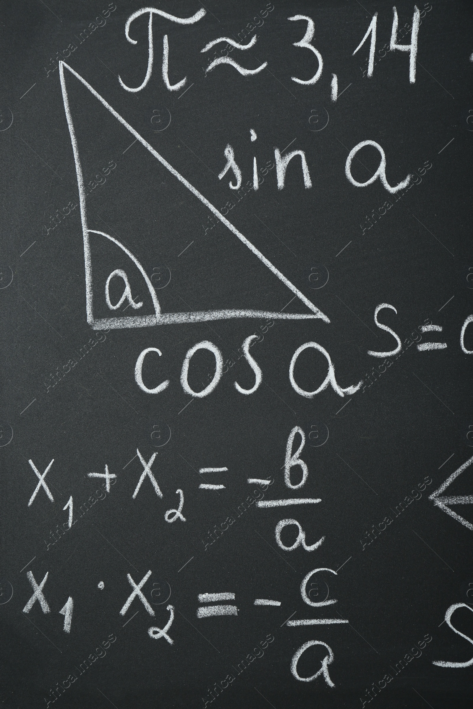 Photo of Many different math formulas written on chalkboard, closeup