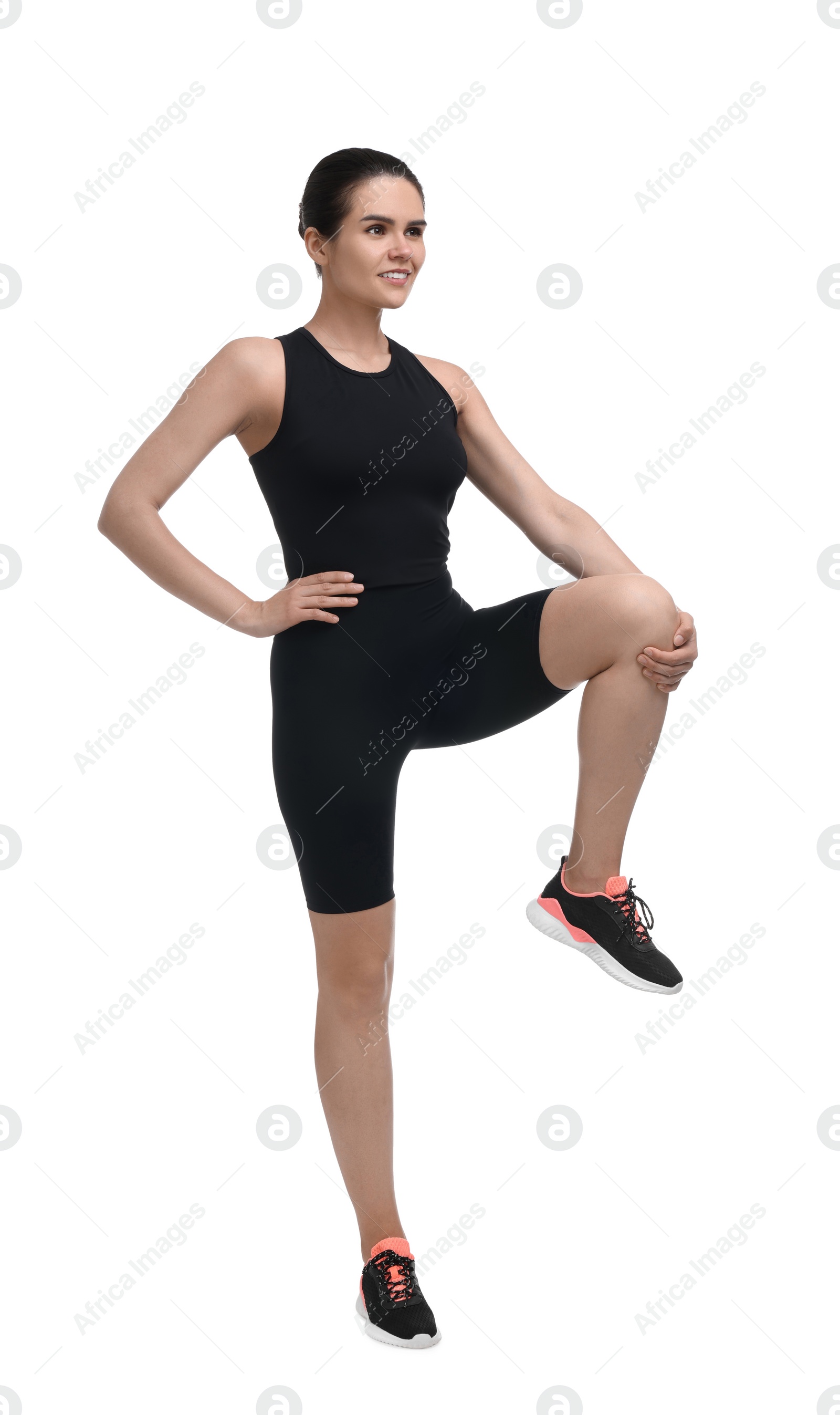 Photo of Happy woman stretching on white background. Morning exercise