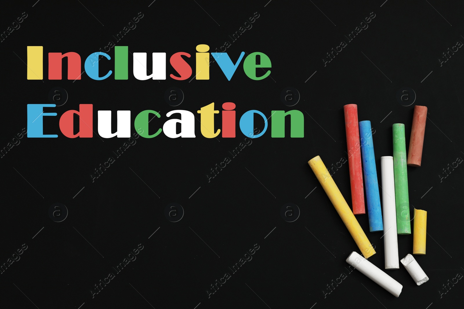 Image of Phrase INCLUSIVE EDUCATION and colorful chalks on blackboard, flat lay