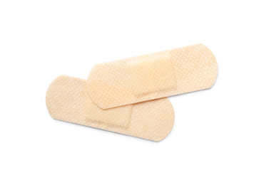 Photo of Medical sticking plasters isolated on white. First aid item
