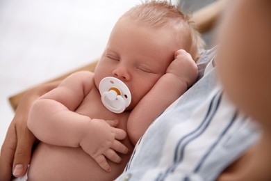 Photo of Mother with her newborn baby, closeup view