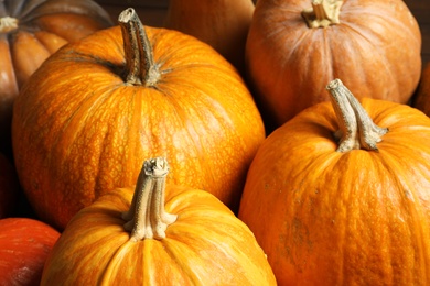 Photo of Many orange pumpkins as background, closeup. Autumn holidays