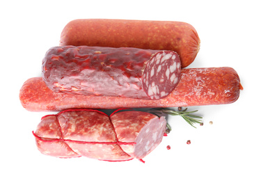 Photo of Different types of sausages on white background, top view