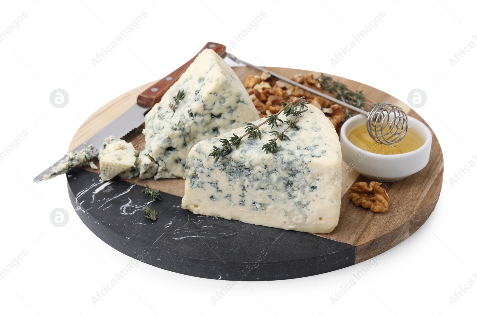 Photo of Serving board with tasty blue cheese, thyme, honey and walnuts isolated on white