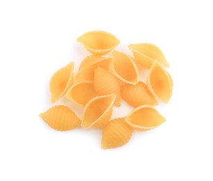 Raw conchiglie pasta isolated on white, top view