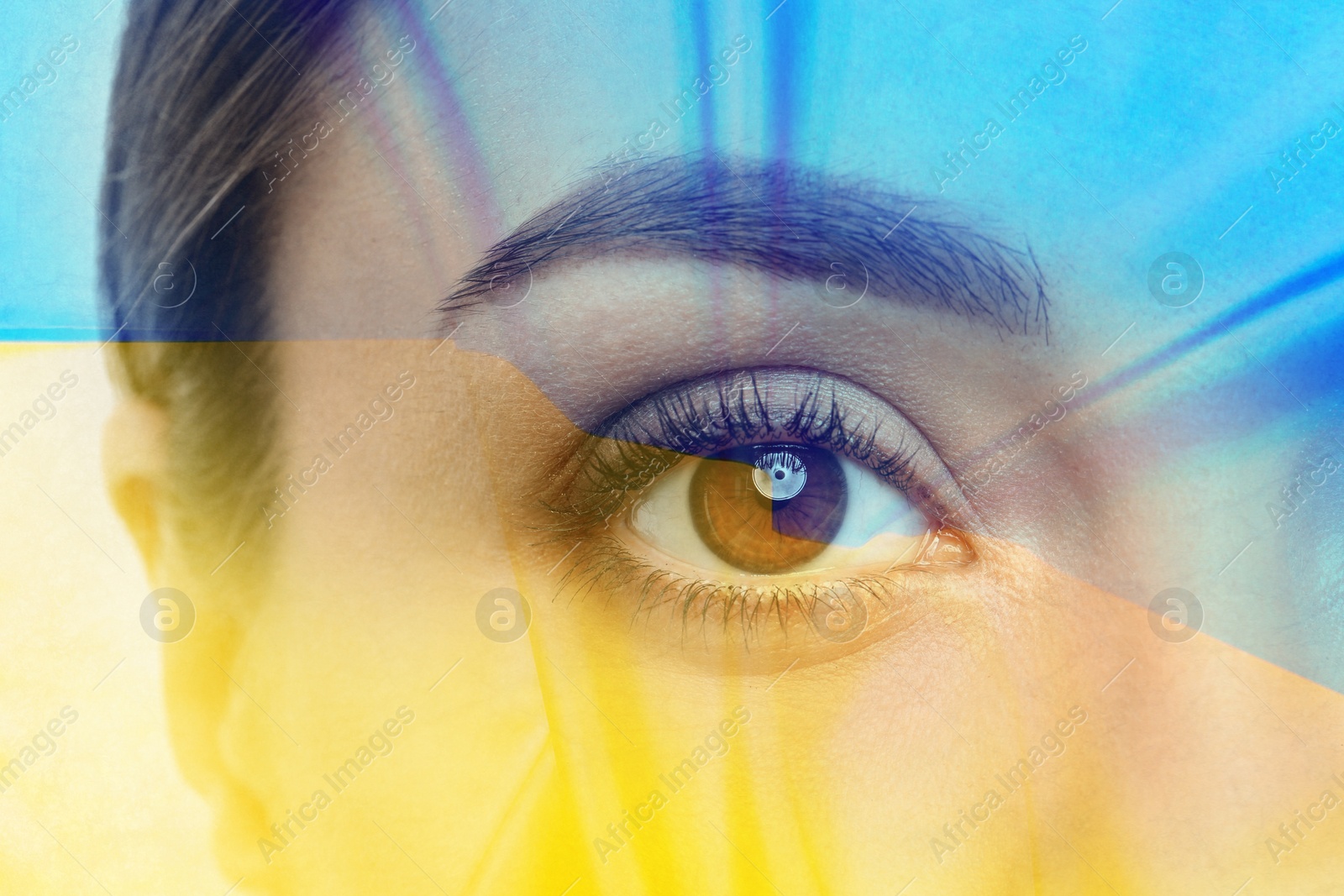 Image of Double exposure of Ukrainian national flag and young woman, closeup view
