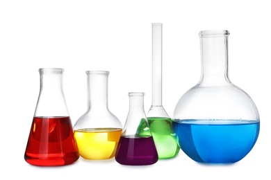 Photo of Laboratory glassware with color liquids on white background