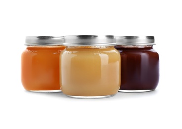 Photo of Jars with healthy baby food on white background