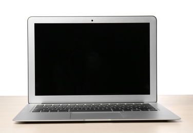 Photo of Modern laptop with blank screen on table against white background