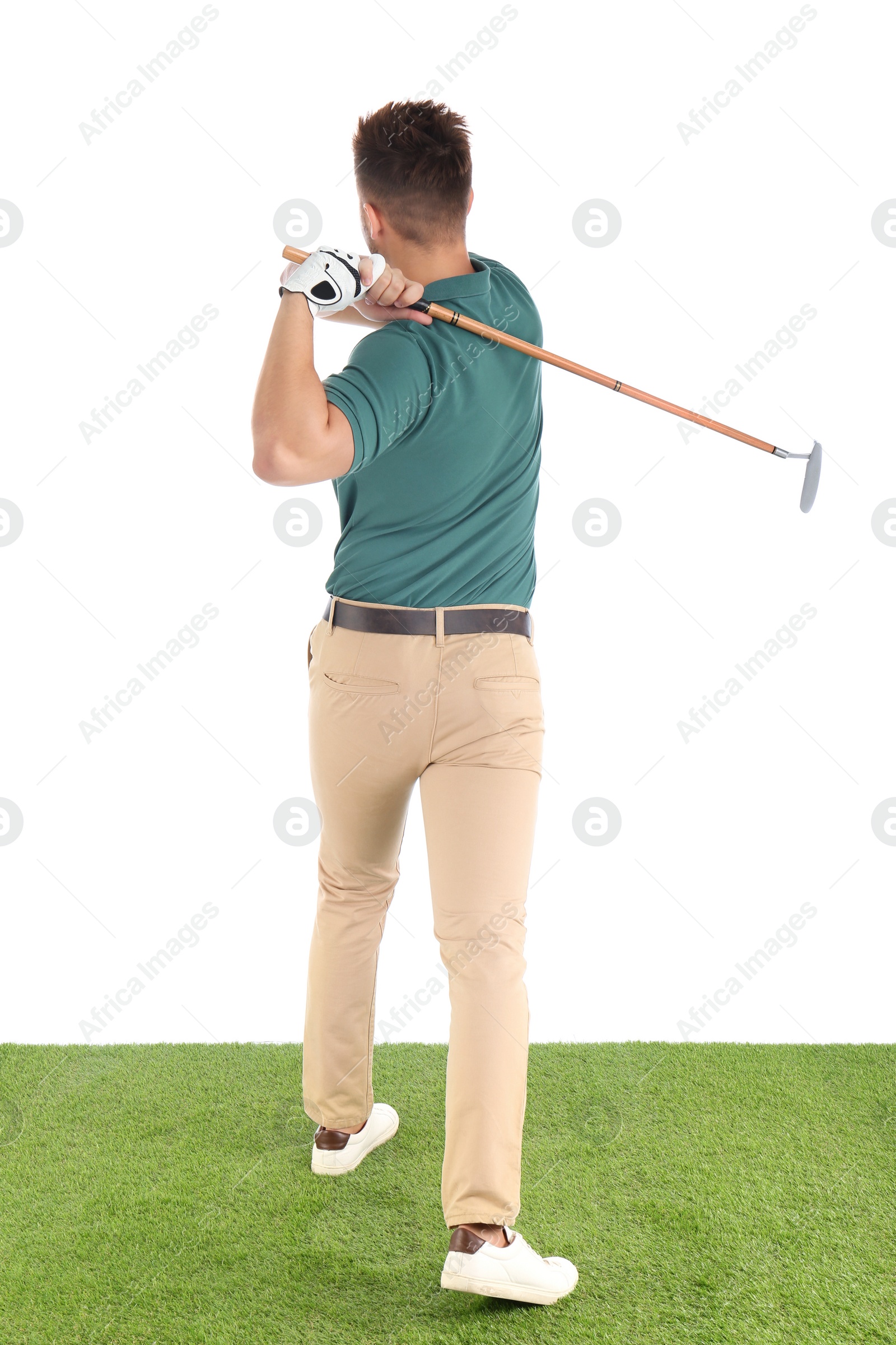 Photo of Young man playing golf on course against white background