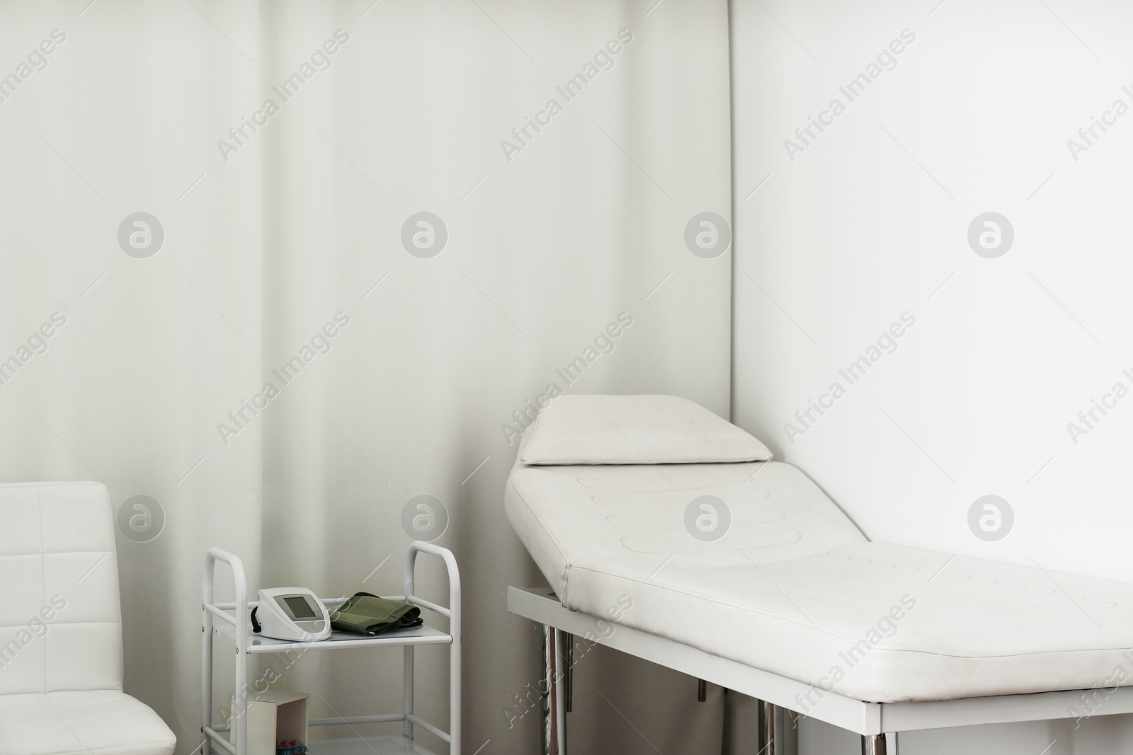 Photo of Empty examination couch in modern medical office