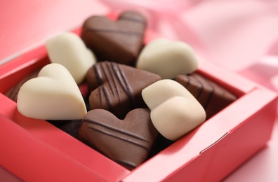 Beautiful heart shaped chocolate candies in box, closeup