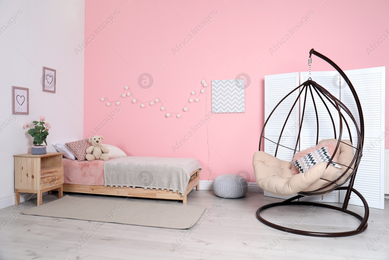 Photo of Cozy child's room interior with comfortable bed