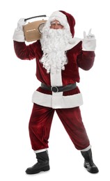 Photo of Santa Claus with vintage radio on white background. Christmas music