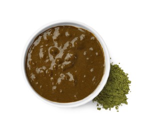 Photo of Henna paste and powder isolated on white, top view