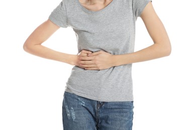 Photo of Young woman suffering from liver pain on white background, closeup