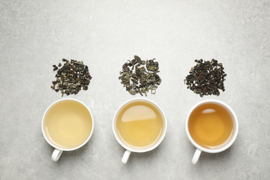 Photo of Flat lay composition with green tea on grey table
