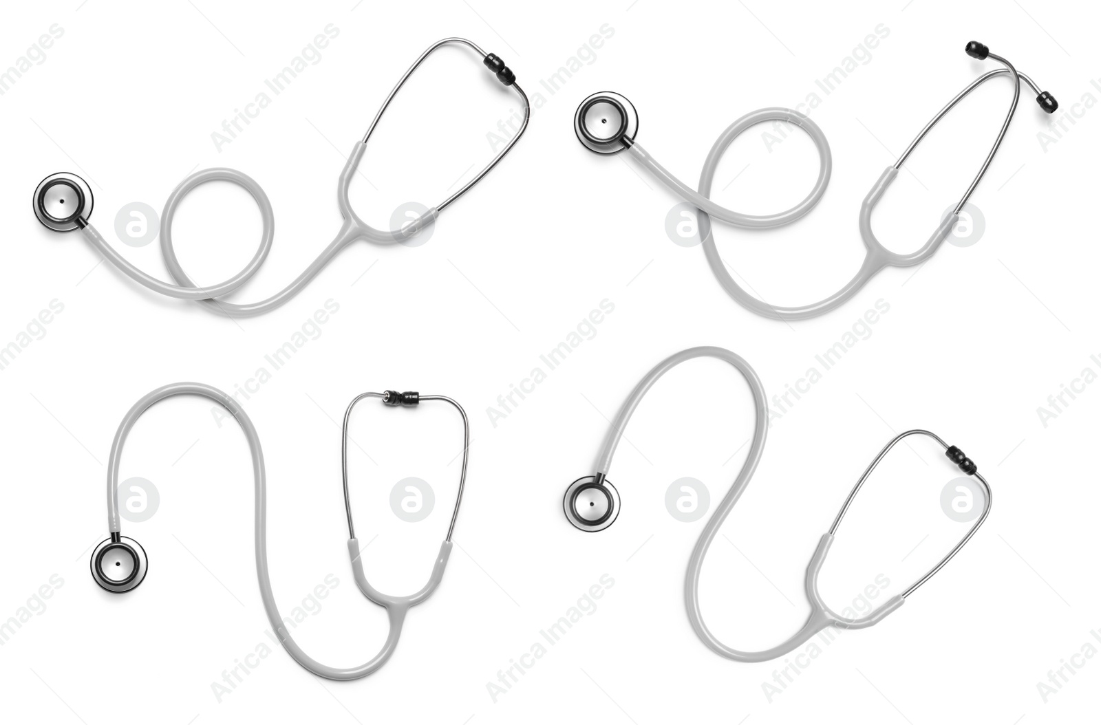 Image of Set with stethoscopes on white background, top view 