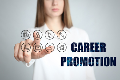 Image of Career promotion concept. Woman touching icon on virtual screen