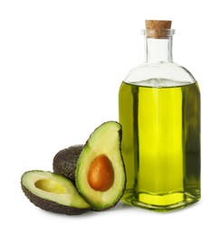 Photo of Vegetable fats. Bottle of cooking oil and fresh avocados isolated on white