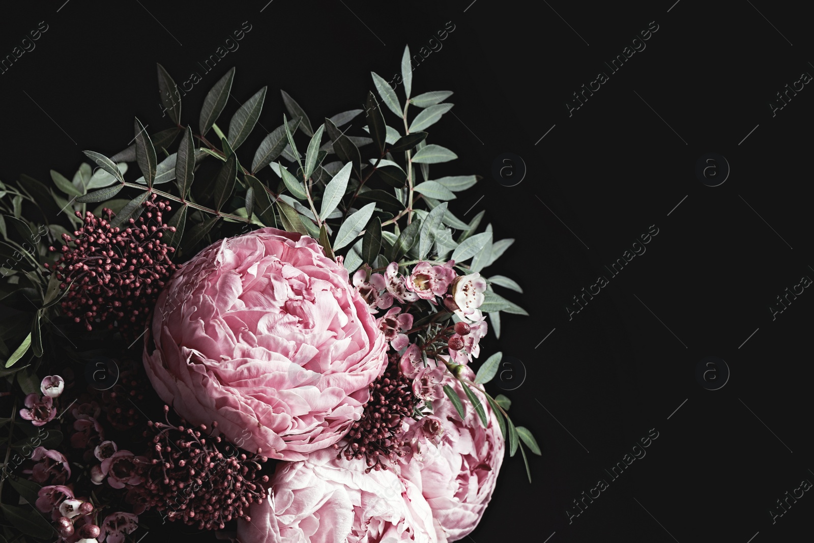 Photo of Beautiful bouquet on black background, space for text. Floral card design with dark vintage effect