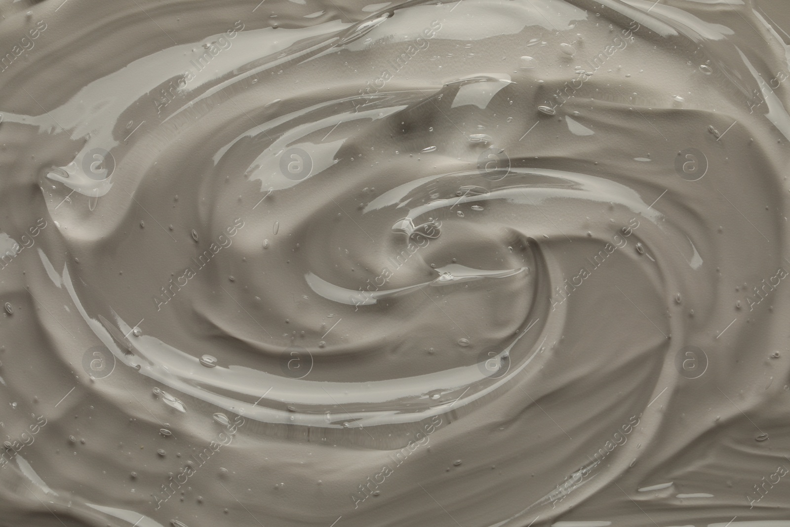 Photo of Clear cosmetic gel on grey background, top view