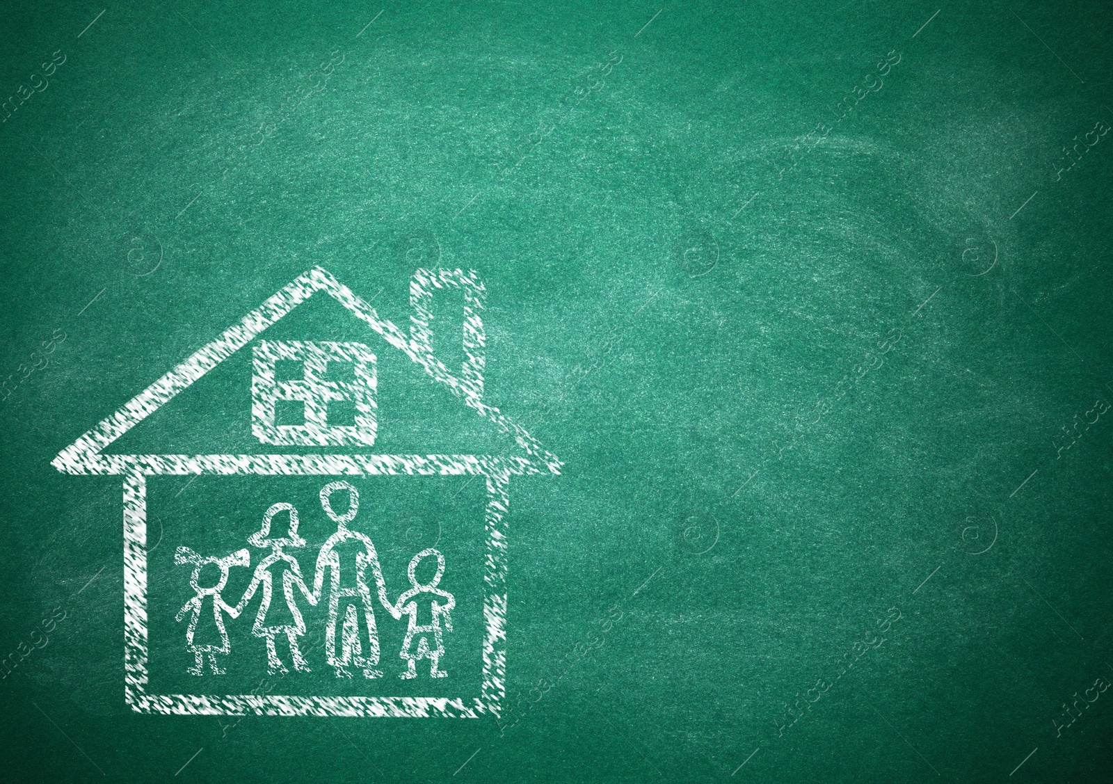 Image of Family in house drawn with chalk on school board