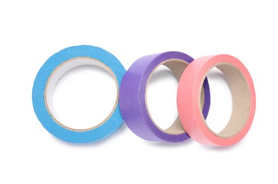 Photo of Different rolls of adhesive tape on white background, top view