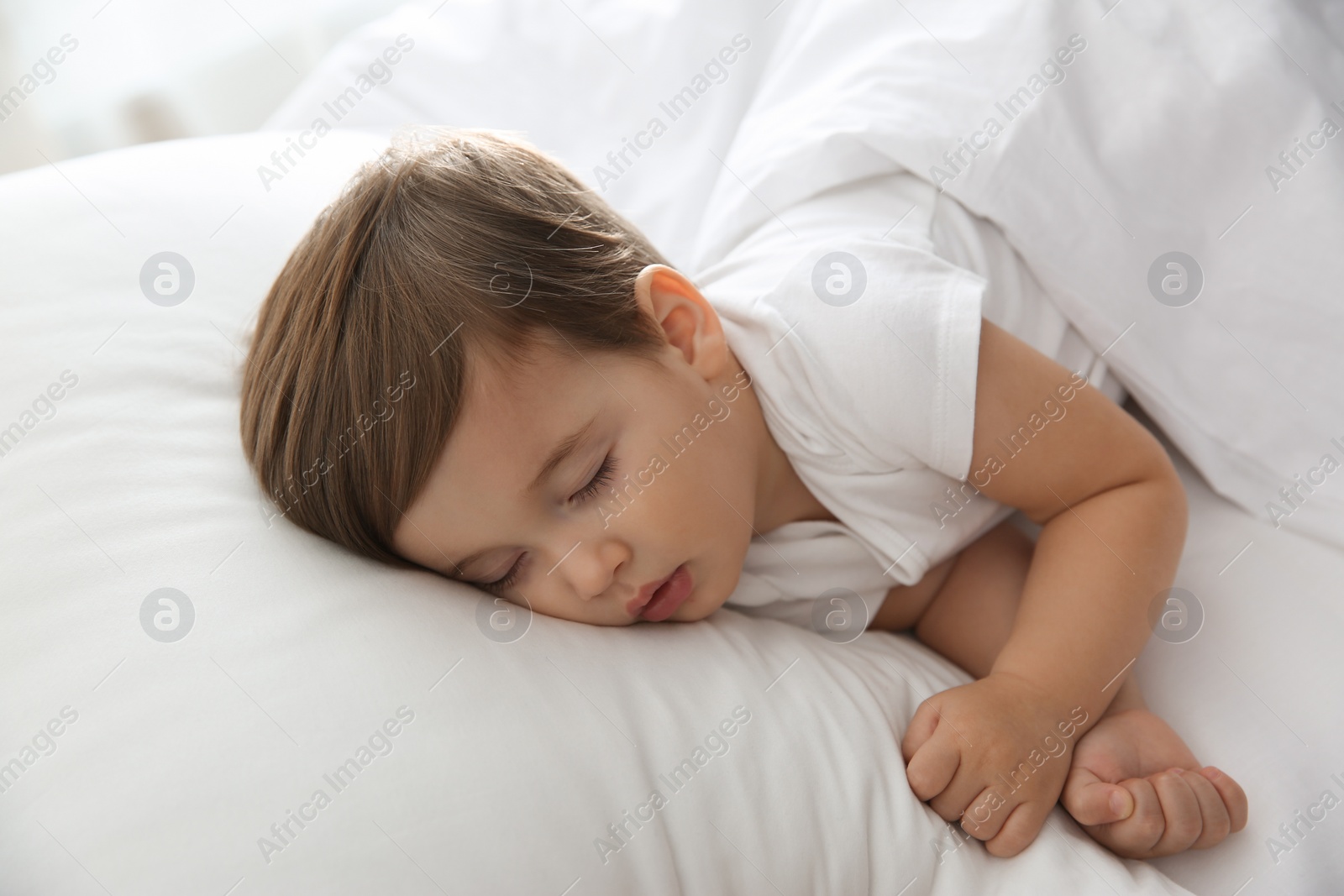 Photo of Cute little baby peacefully sleeping at home. Bedtime