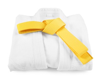 Photo of Yellow karate belt and kimono isolated on white