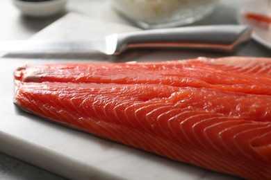 Fresh salmon for sushi on table, closeup