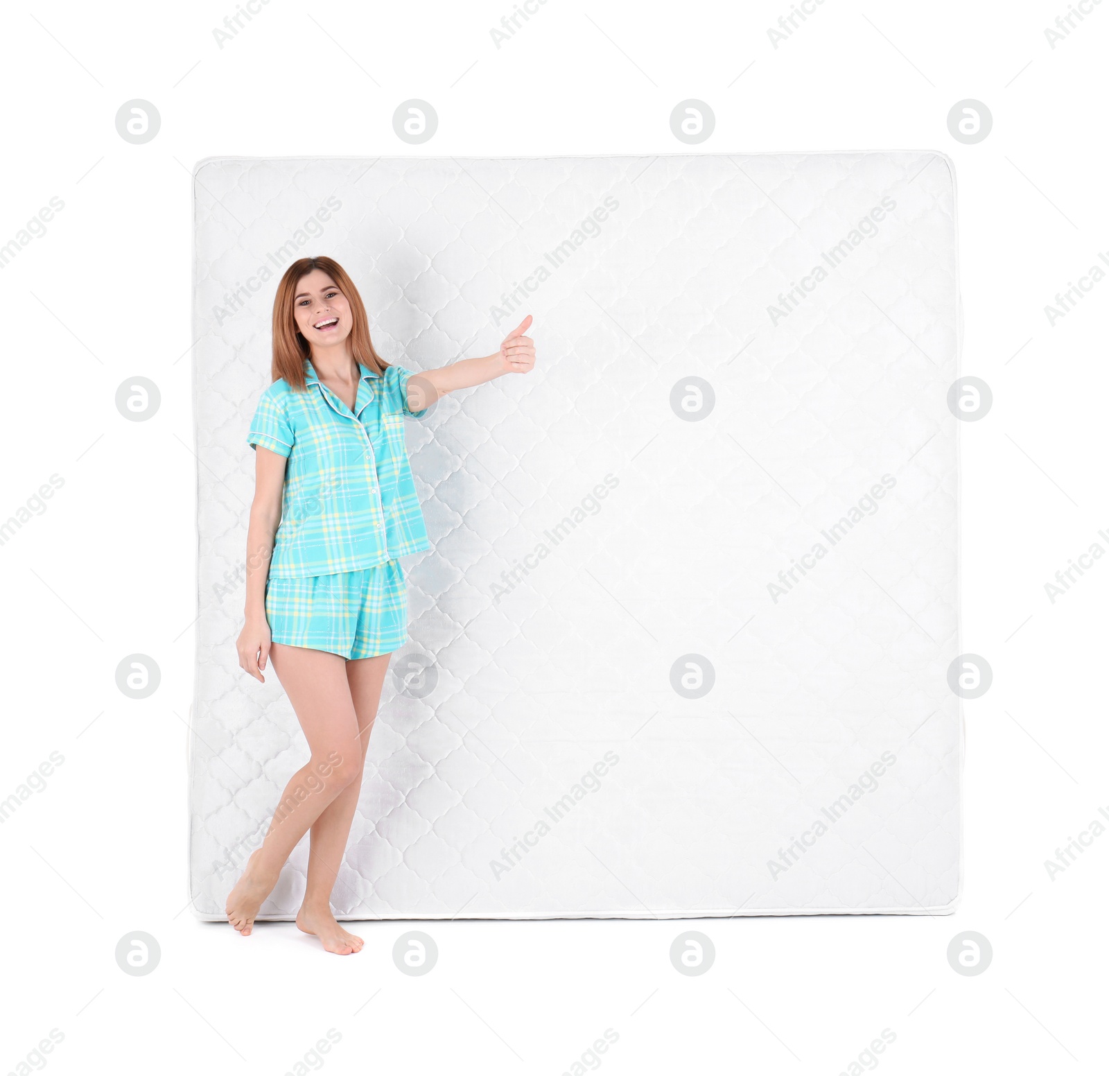 Photo of Woman with comfortable mattress isolated on white