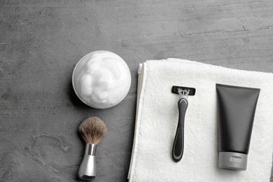 Photo of Flat lay composition with men's cosmetic products on grey background. Space for design