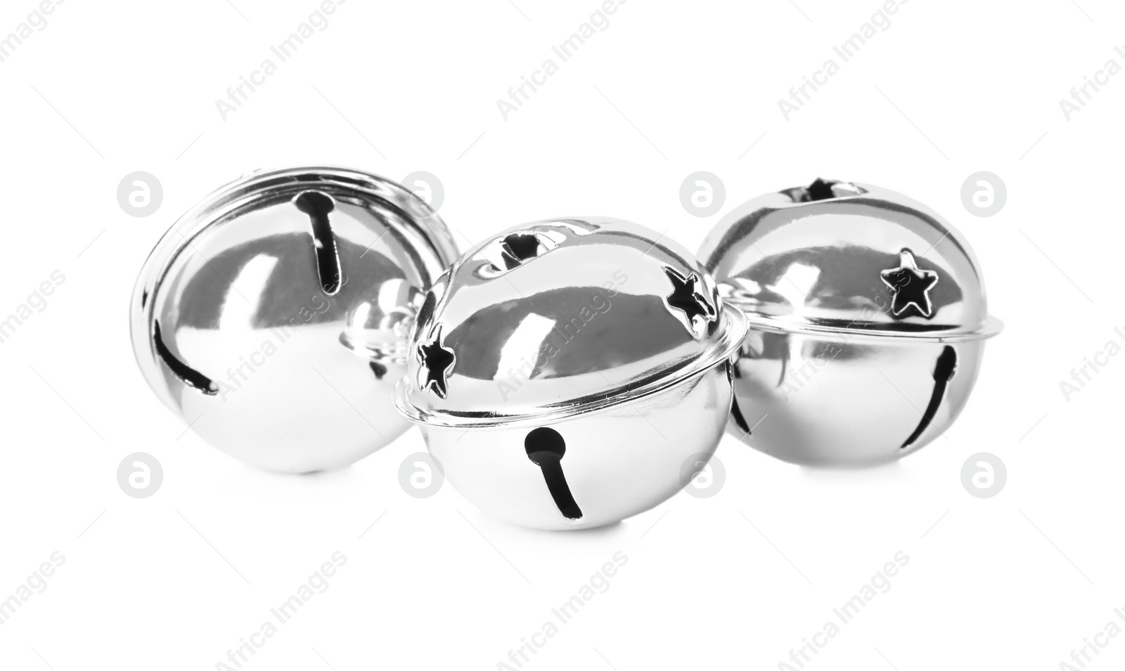 Photo of Shiny silver sleigh bells on white background