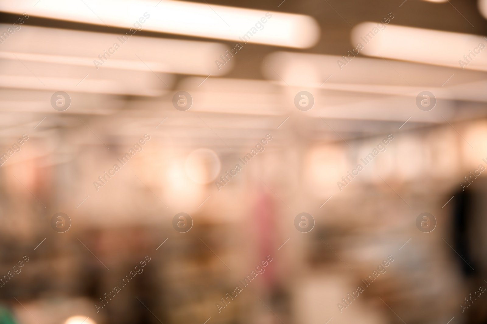 Photo of Blurred view of modern shopping mall interior