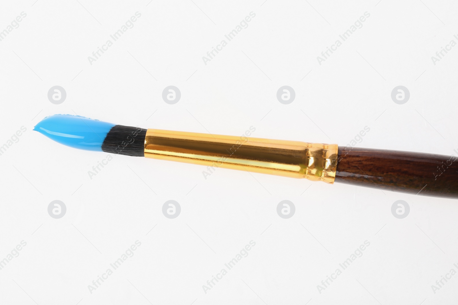 Photo of Brush with color paint on white background, top view