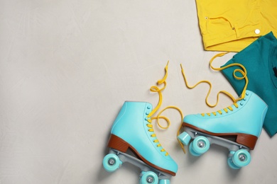 Flat lay composition with quad roller skates and space for text on light background