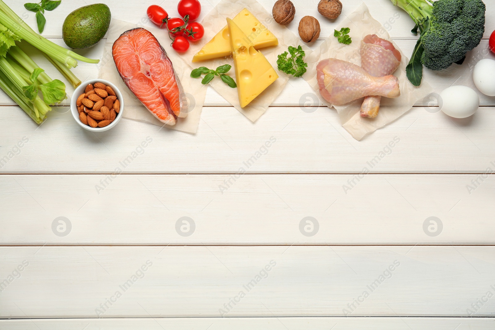 Photo of Flat lay composition with different fresh products on white wooden table, space for text. Keto diet