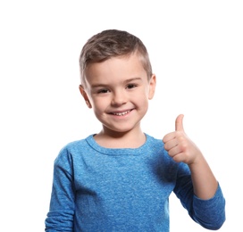 Photo of Little boy showing THUMB UP gesture in sign language on white background