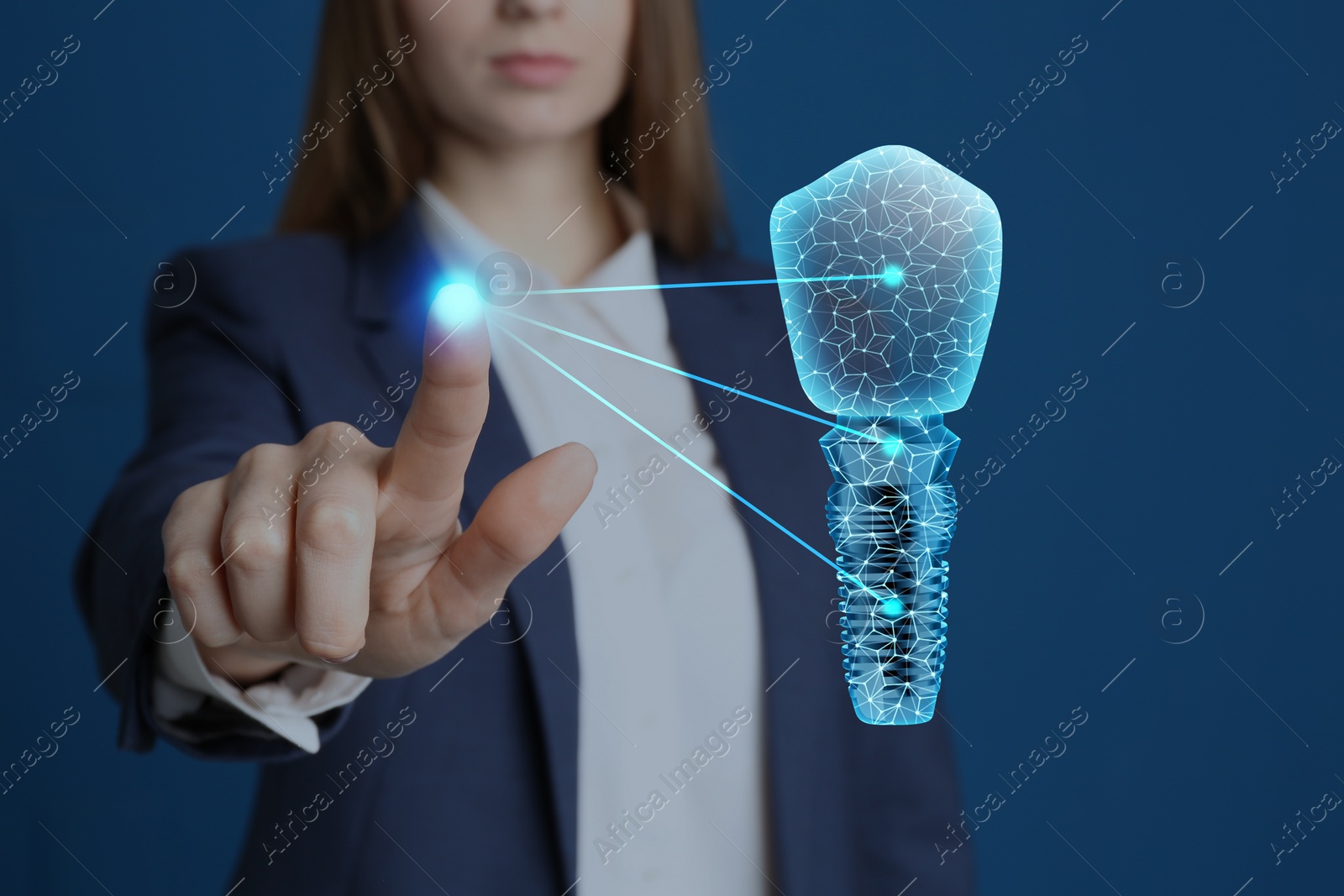 Image of Woman demonstrating virtual image of dental implant on blue background, closeup