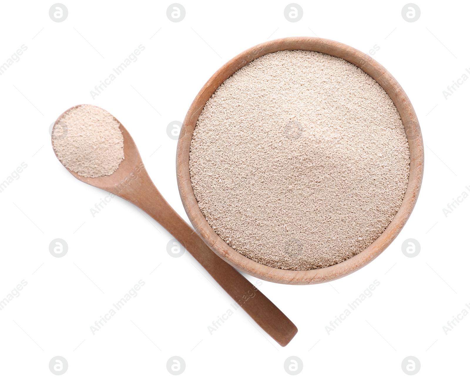 Photo of Bowl and spoon with active dry yeast isolated on white, top view