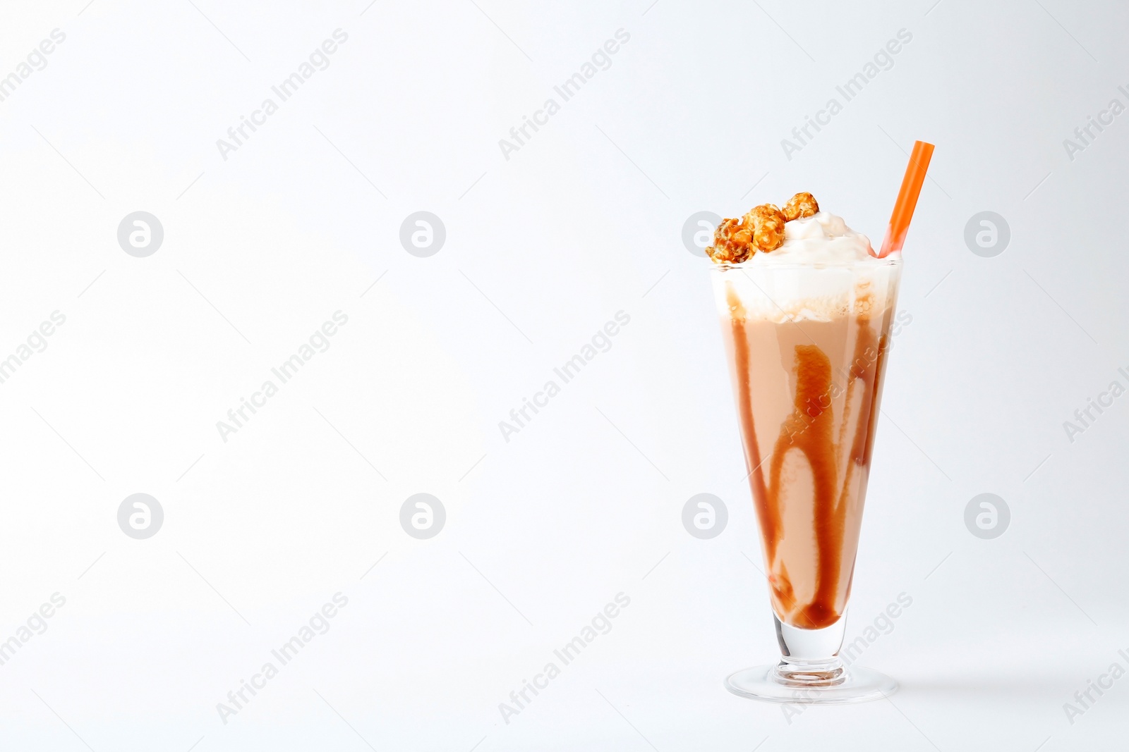 Photo of Glass with delicious milk shake on white background