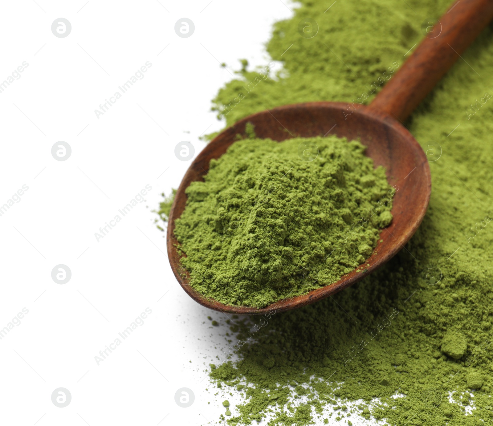 Photo of Green matcha powder and wooden spoon isolated on white