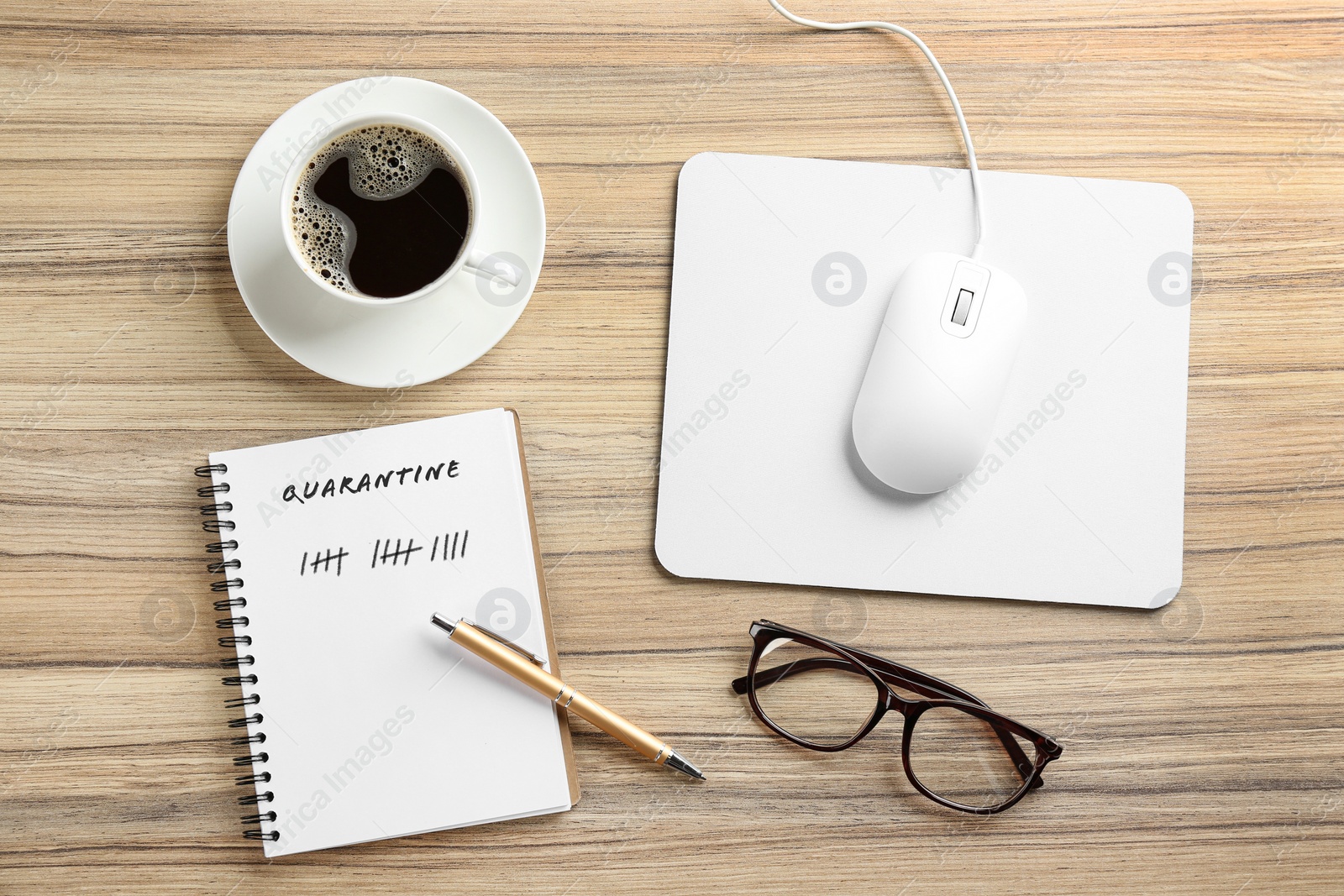 Image of Flat lay composition with mouse and cup of coffee on wooden table. Counting days of quarantine during coronavirus outbreak